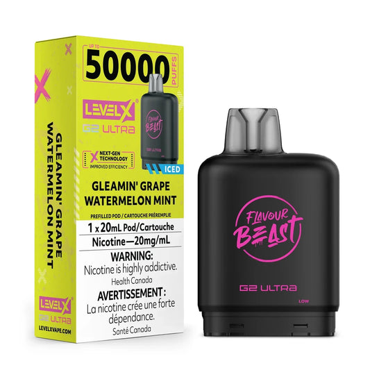 A black Flavour Beast G2 Ultra vape pod stands next to its bright yellow packaging box, which features the Level X branding, a 50,000 puff count, and the Gleamin' Grape Watermelon Mint flavor name.