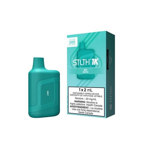 A teal STLTH 1K Mint disposable vape device stands next to its matching teal and white packaging, which displays the STLTH 1K logo and a nicotine warning label.