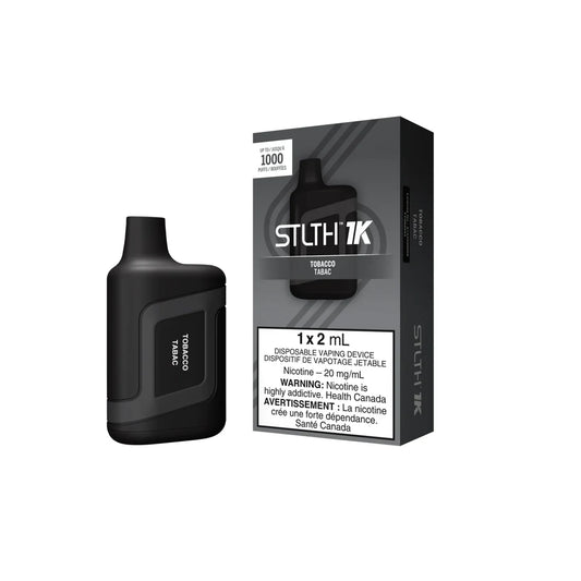 STLTH 1K Tobacco disposable vape device and its grey and black packaging featuring 1000 puffs and nicotine warning labels against a solid black background.