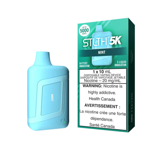 A light blue STLTH 5K Mint disposable vape device stands next to its teal and white packaging, which features the STLTH 5K logo, 5000 puffs, and a nicotine warning label.