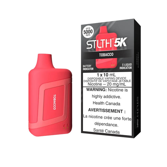 A red STLTH 5K Tobacco disposable vape device stands next to its black and grey retail packaging, featuring labels for 5000 puffs, 20 mg/mL nicotine, and battery and e-liquid indicators.