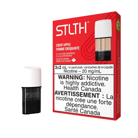 A red STLTH Crisp Apple pod pack box featuring a single 2mL e-liquid pod with a white cap and black base standing next to it on a plain black background.
