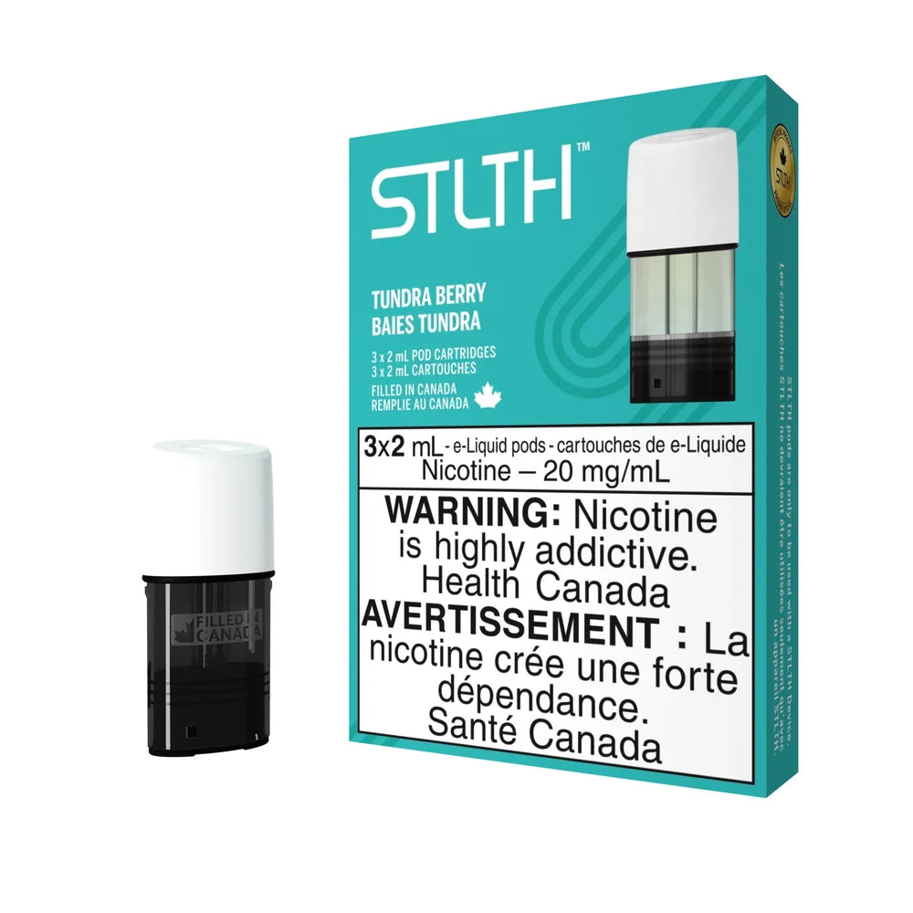 A pack of STLTH Tundra Berry e-liquid pod cartridges featuring teal and white packaging with a single black and white replacement pod displayed alongside.