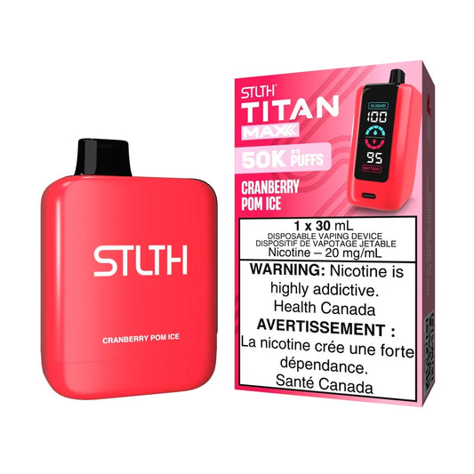 A red STLTH Titan Max 50K Cranberry Pom Ice disposable vape device stands next to its pink and red packaging, featuring a digital screen showing e-liquid and battery levels.