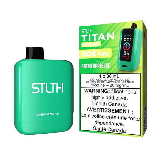 A bright green STLTH Titan Max 50K Green Apple Ice disposable vape device stands next to its matching lime green packaging, which displays a digital screen showing e-liquid and battery levels.
