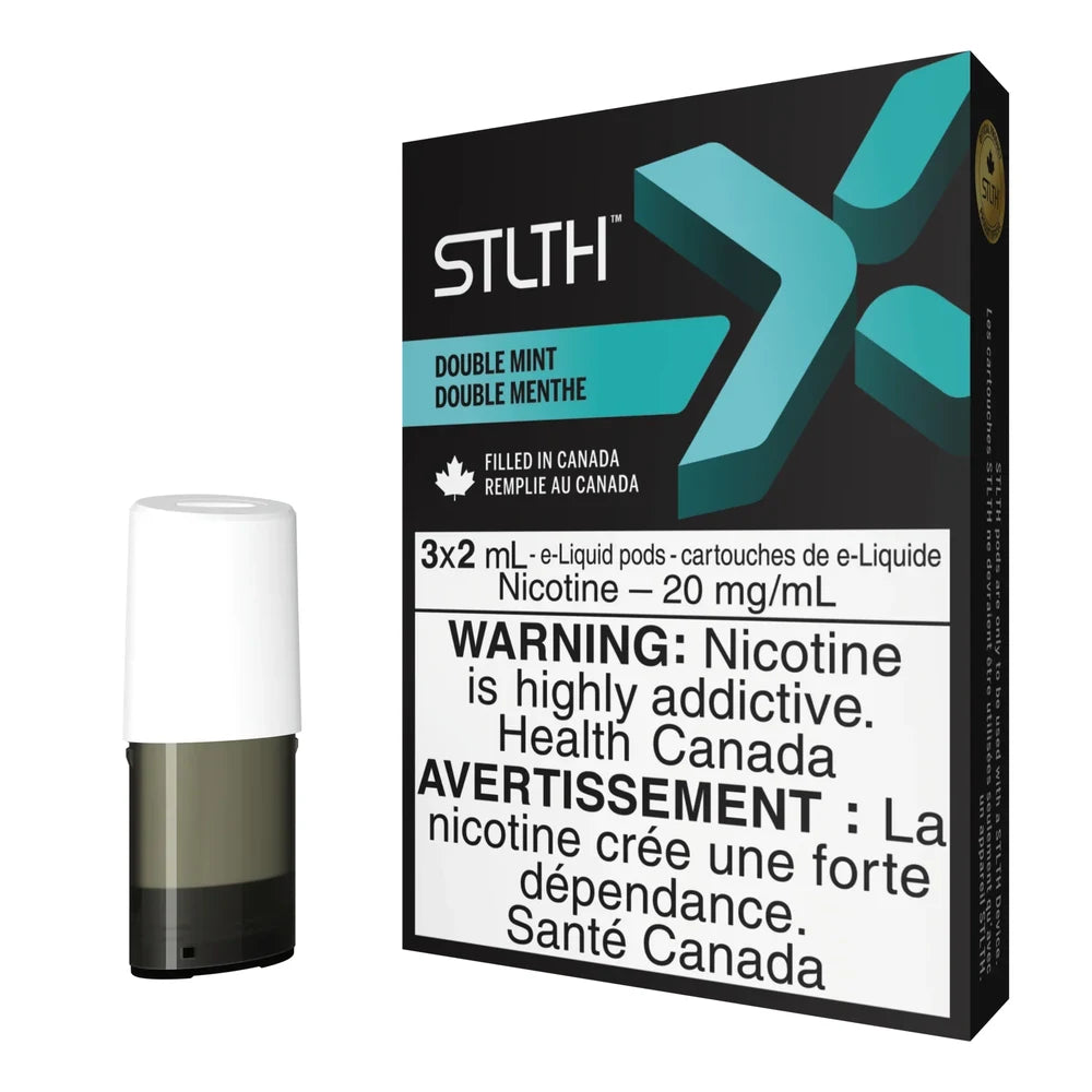 A black STLTH X Double Mint pod pack featuring a teal X logo and a single white and grey replacement vape pod standing next to the box.